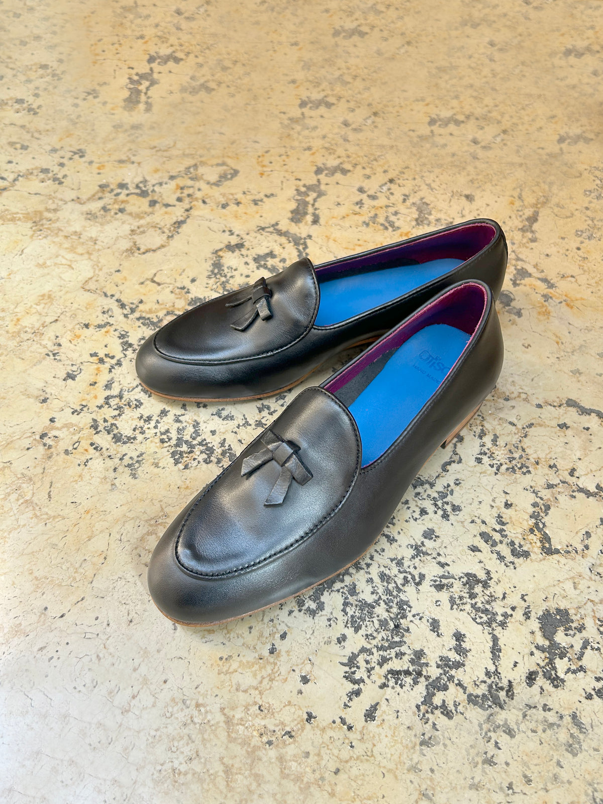 Black leather slippers